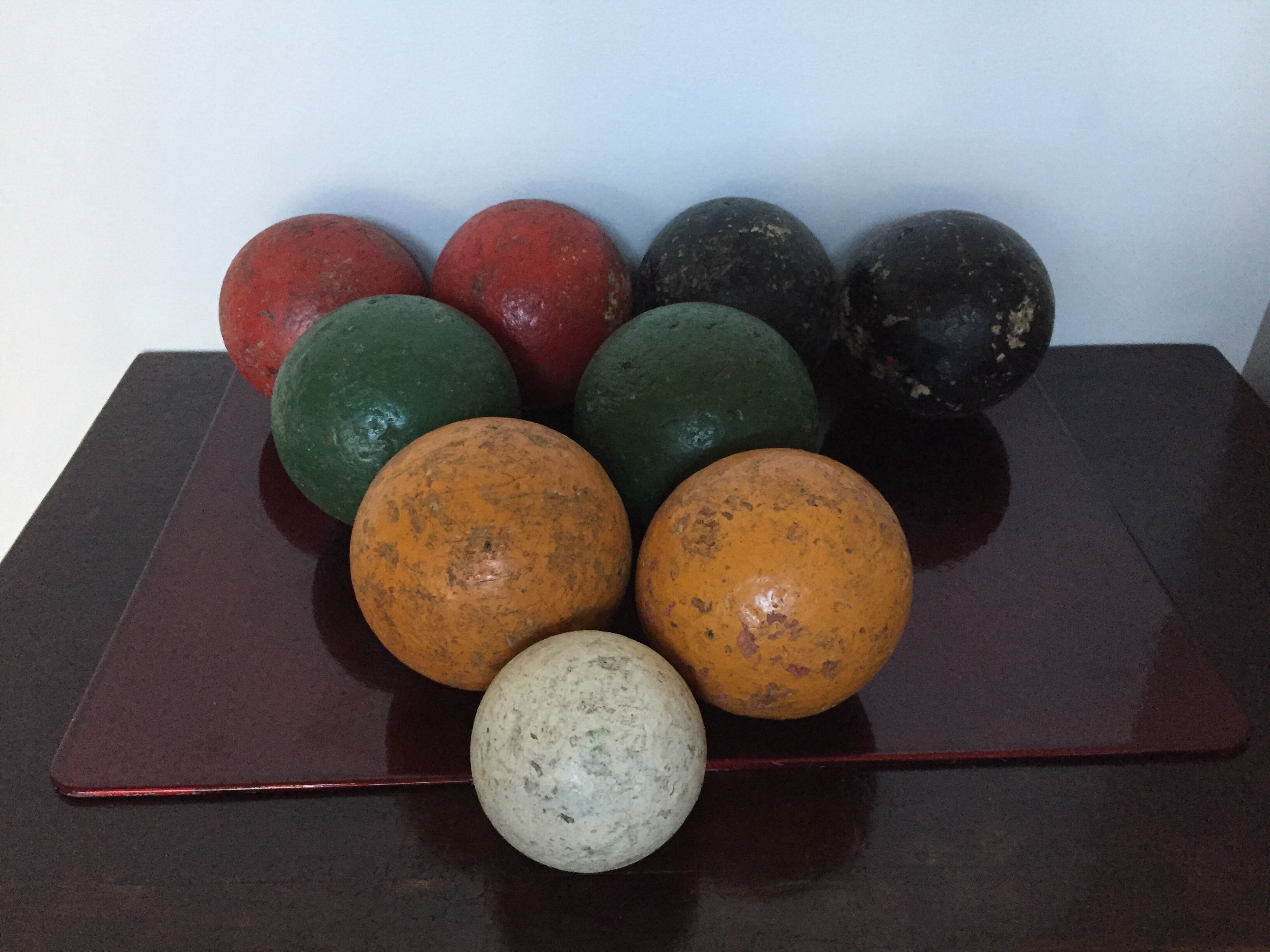 Very old game of wooden petanque balls with piglet