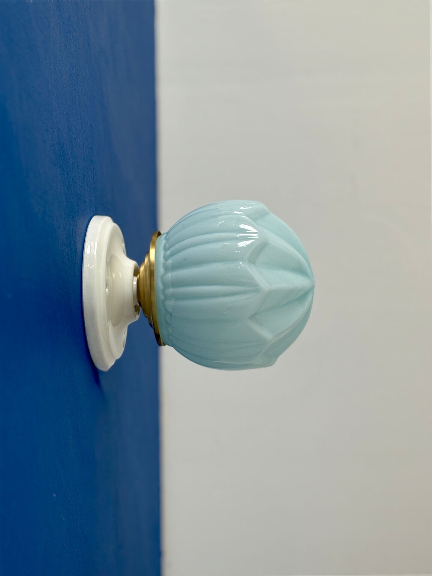 Vintage Art Deco globe wall light in blue opaline.