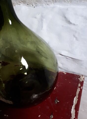 Dark green demijohn