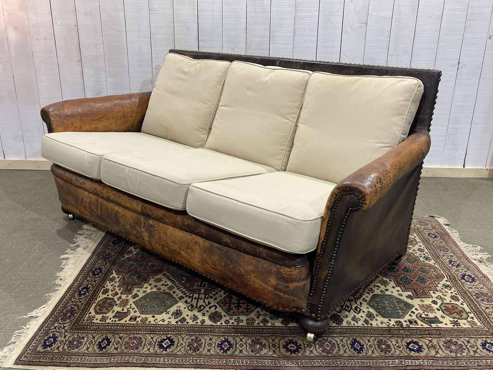 Early 20th century leather club sofa - seat and back in modern fabric