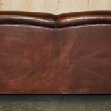 George Smith Signature Scroll leather canapé with tartan Scottish wool cushions.