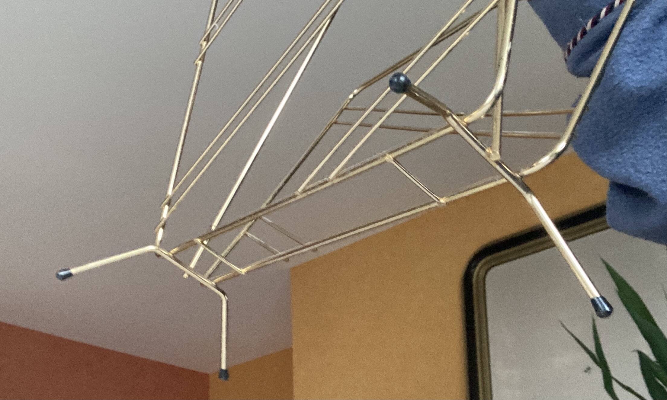 Vintage gold metal magazine rack
