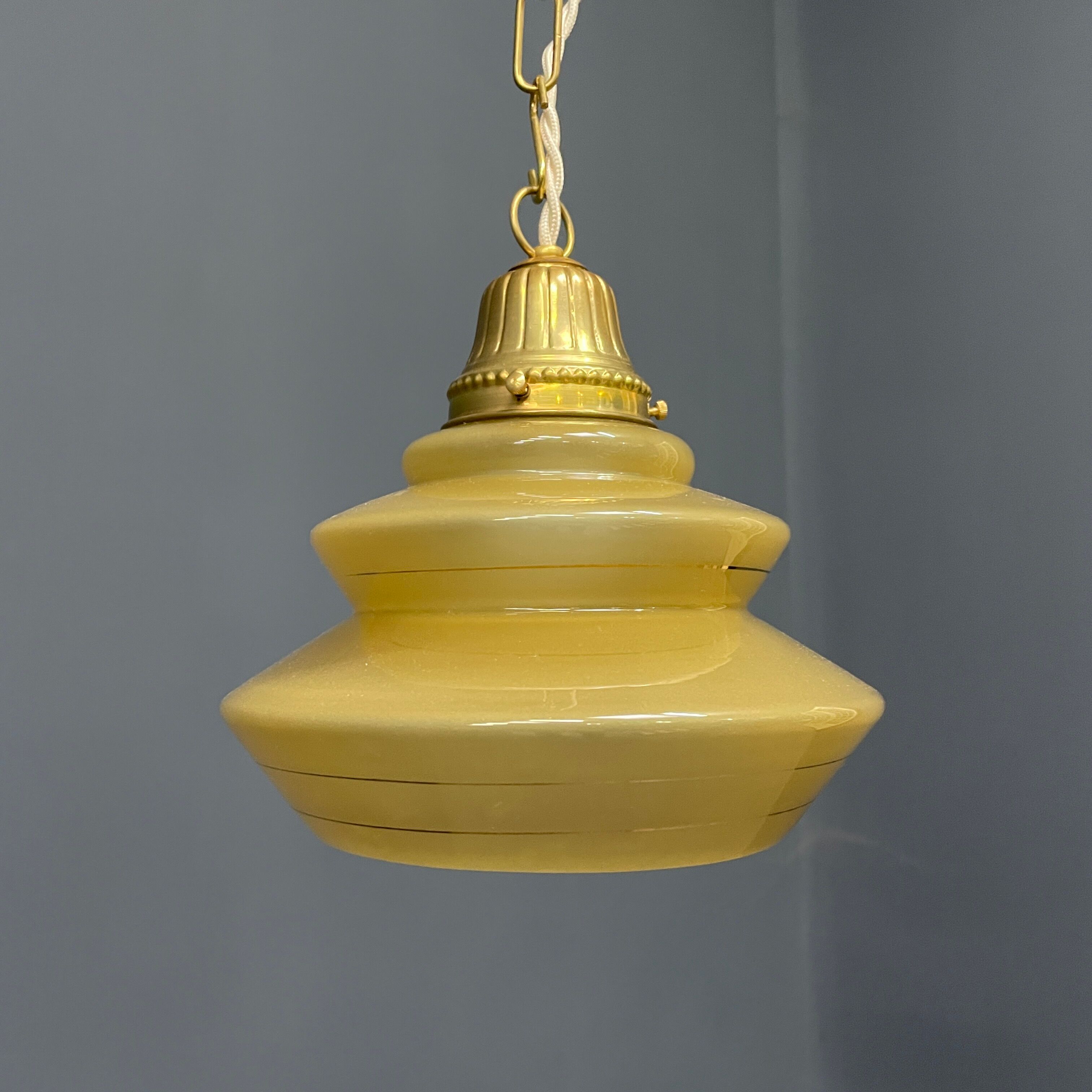 Vintage ocher glass hanging lamps with brass gallery