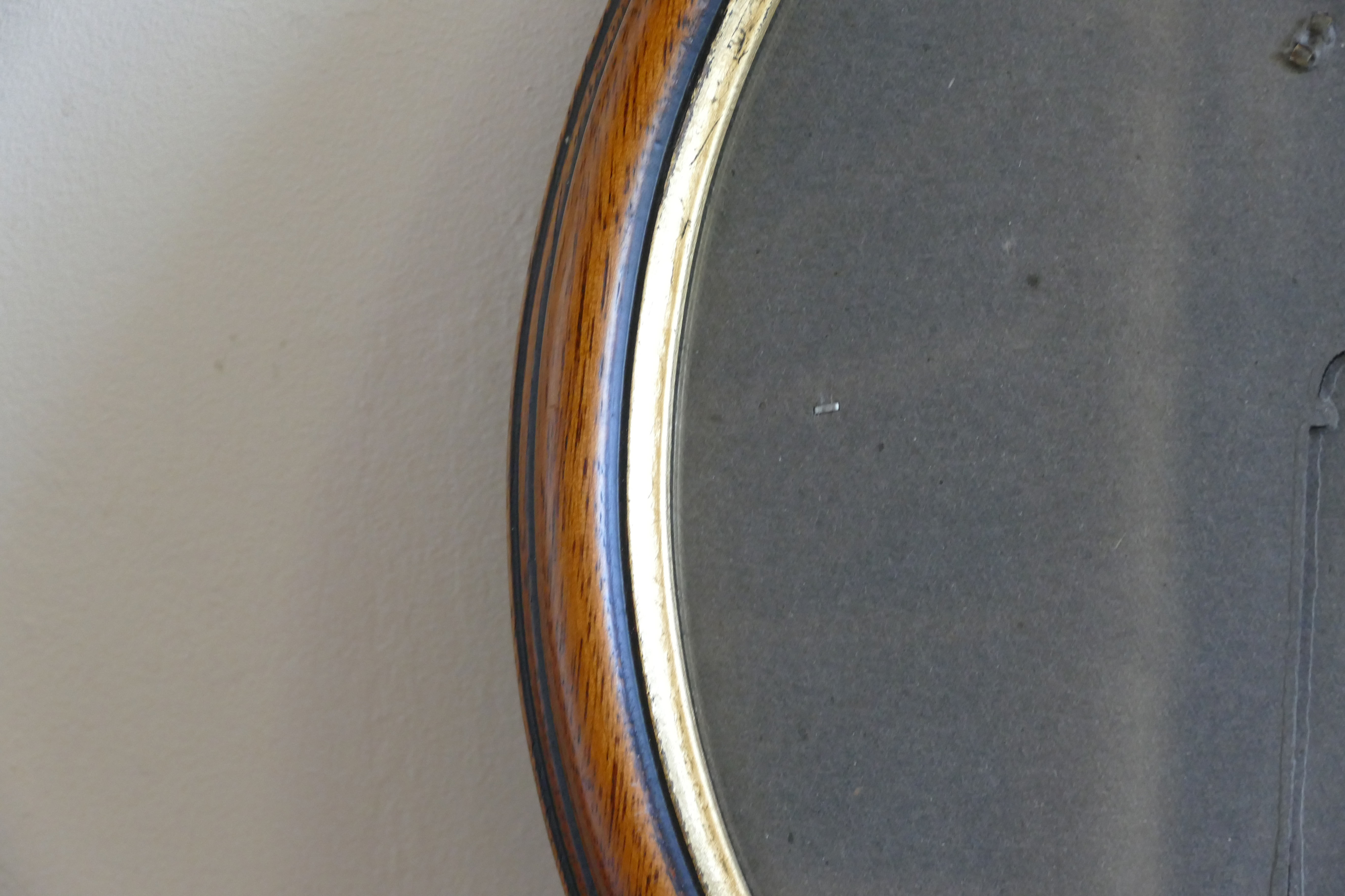 Oval wooden frame and gilded painted