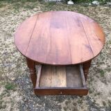 Louis Philippe oval shuttered table in solid cherry wood with 2 drawers.