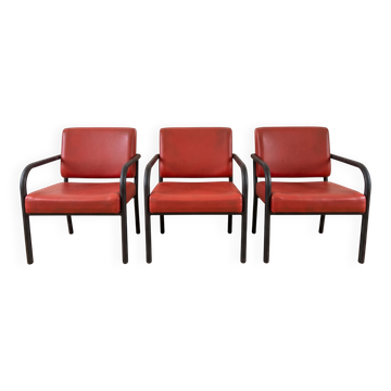 3 red leather and metal armchairs