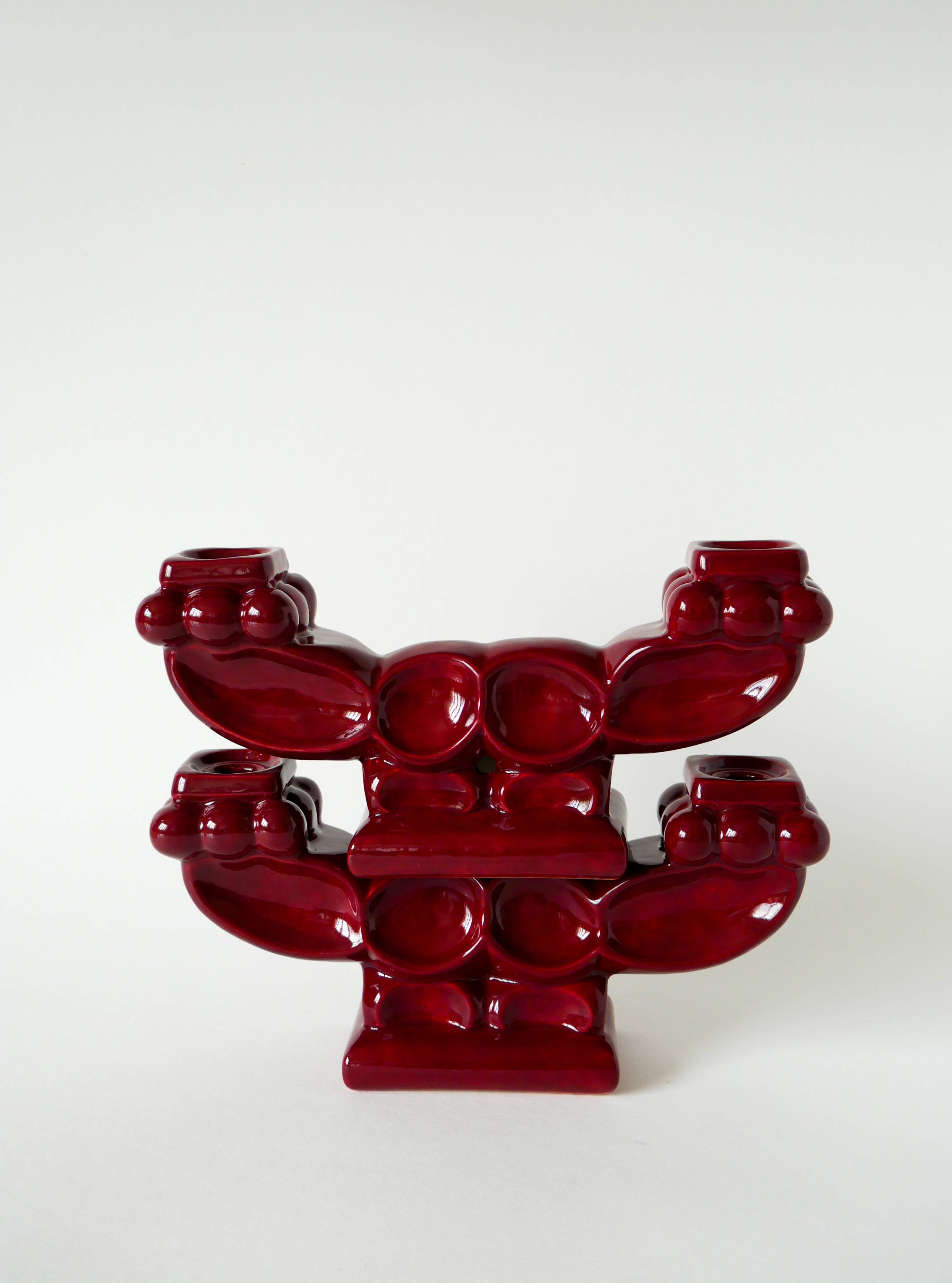 Pair of large burgundy ceramic candlesticks, 1950