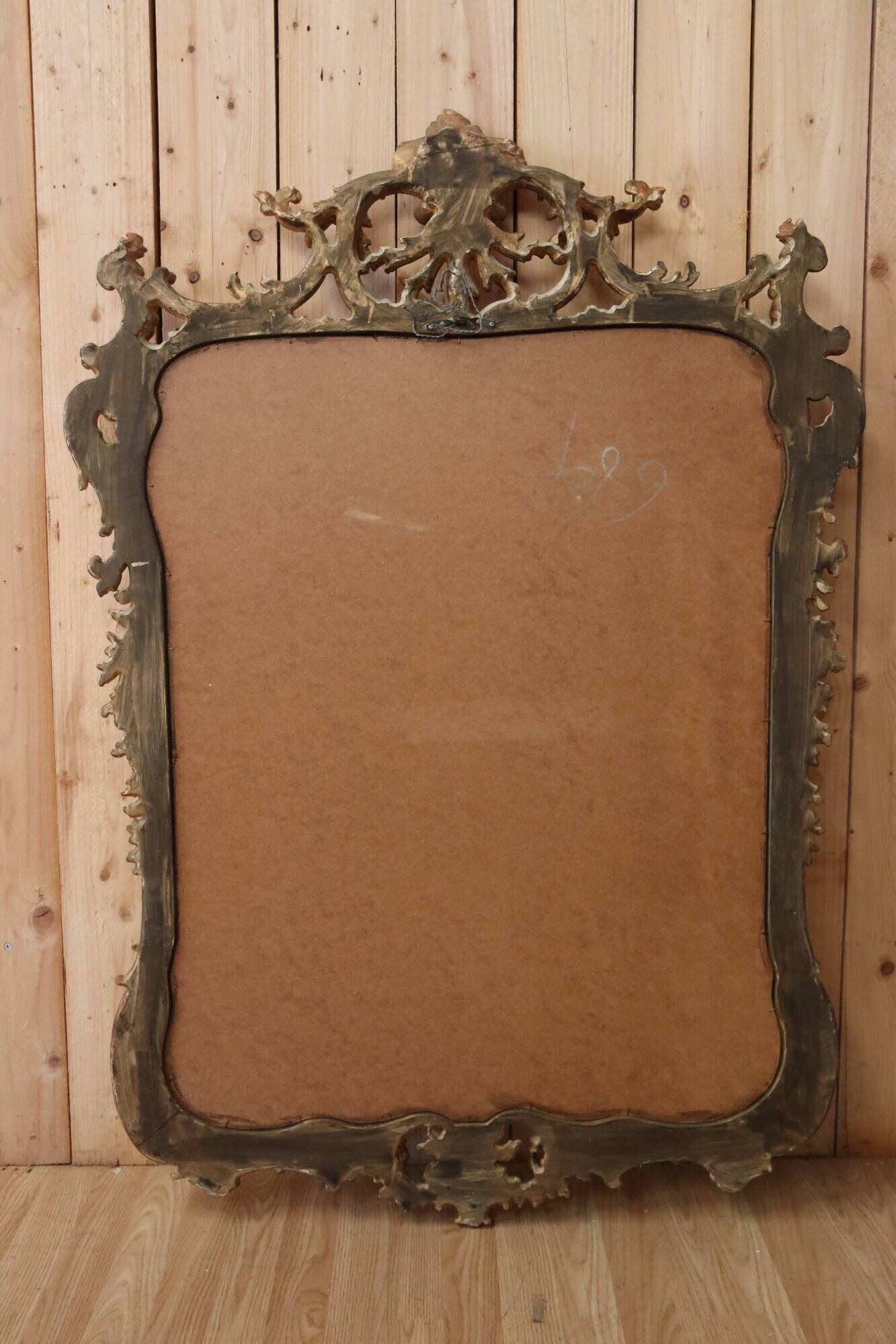 Golden wooden mirror in Louis XV style