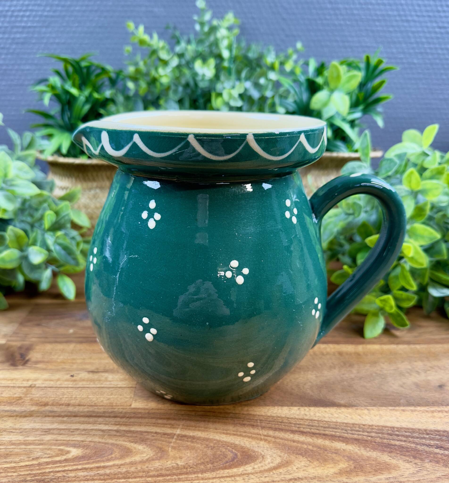 Green glazed ceramic jug