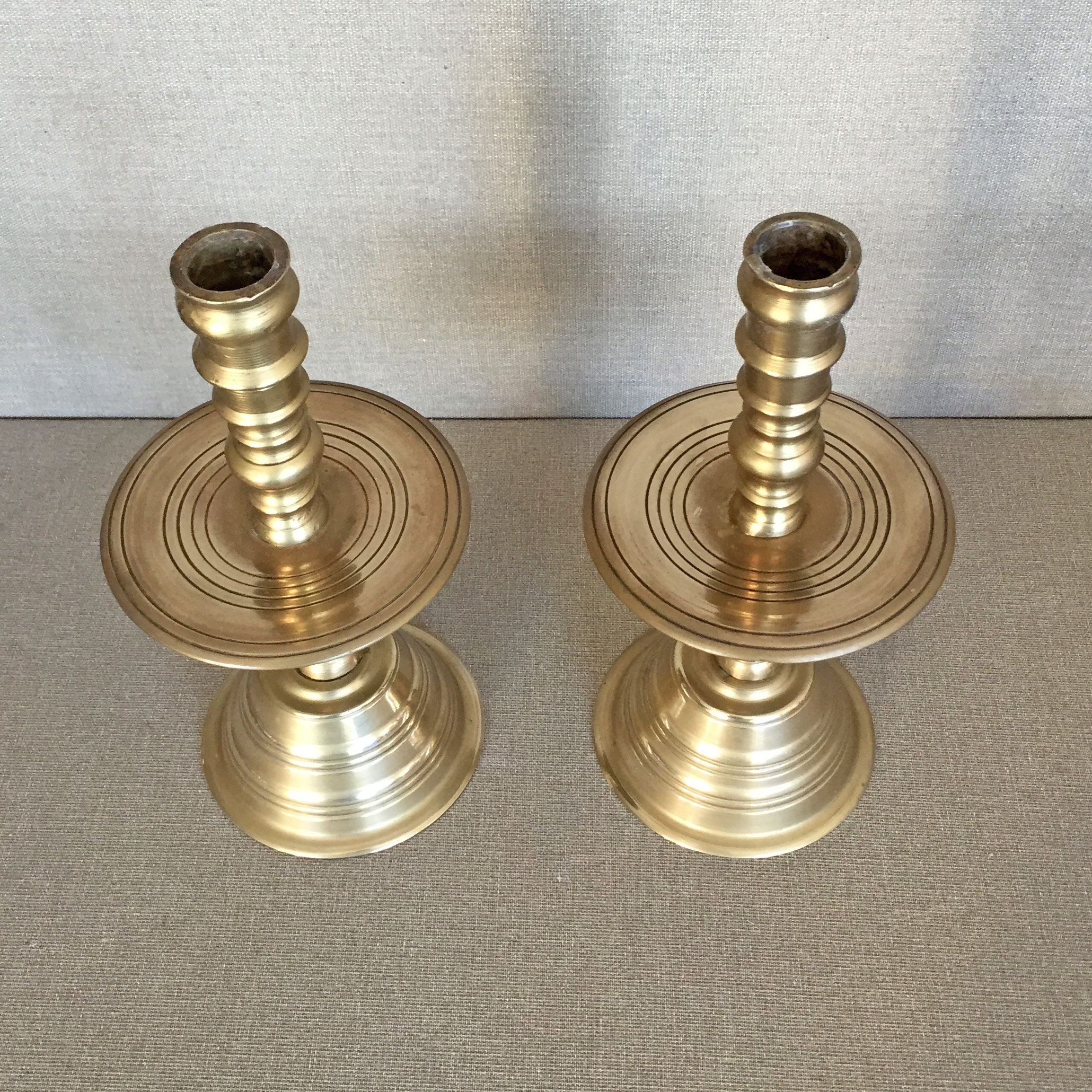 Pair of bronze church candle holders