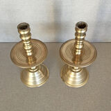 Pair of bronze church candle holders