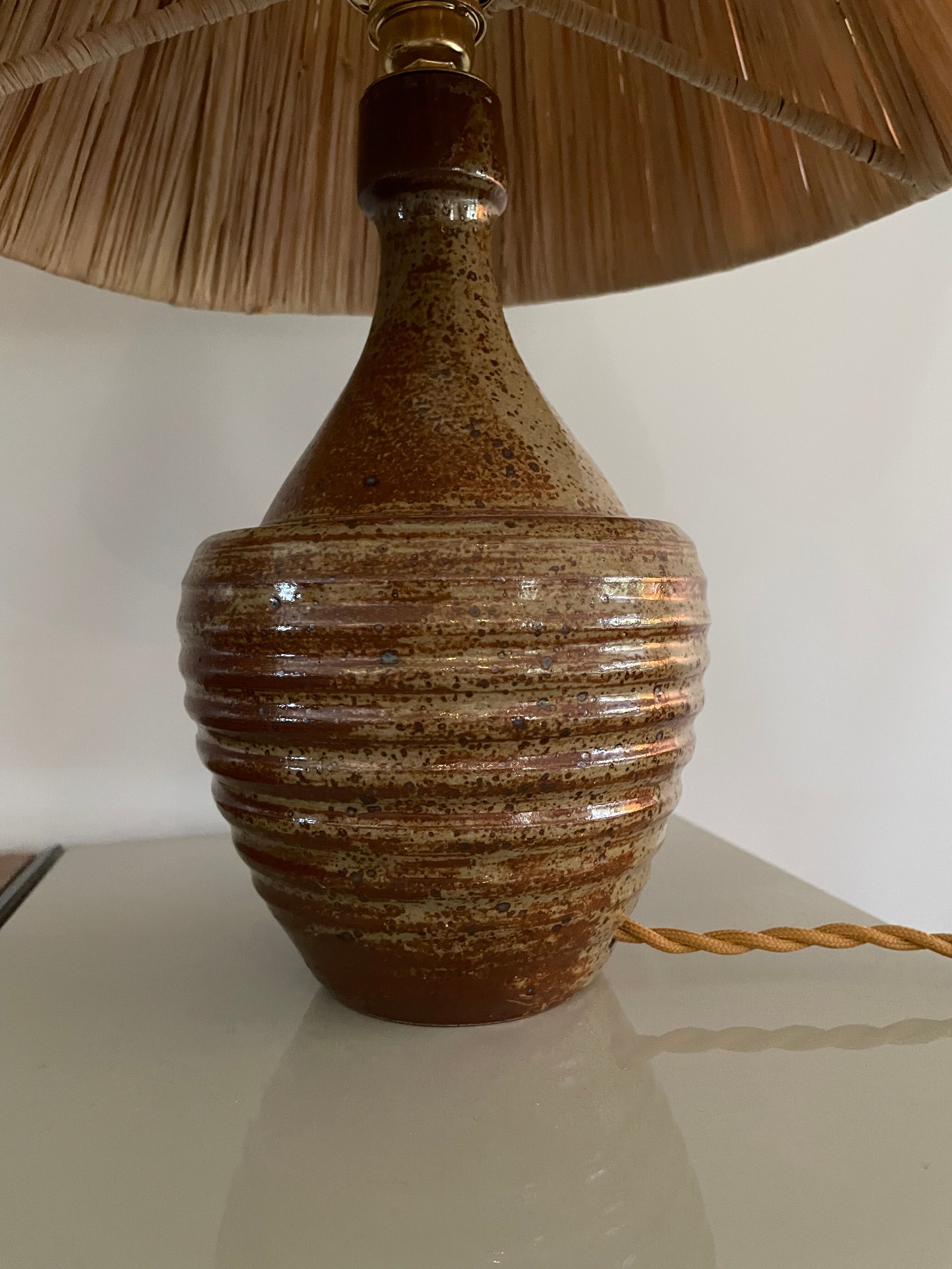 Sandstone lamp and raffia