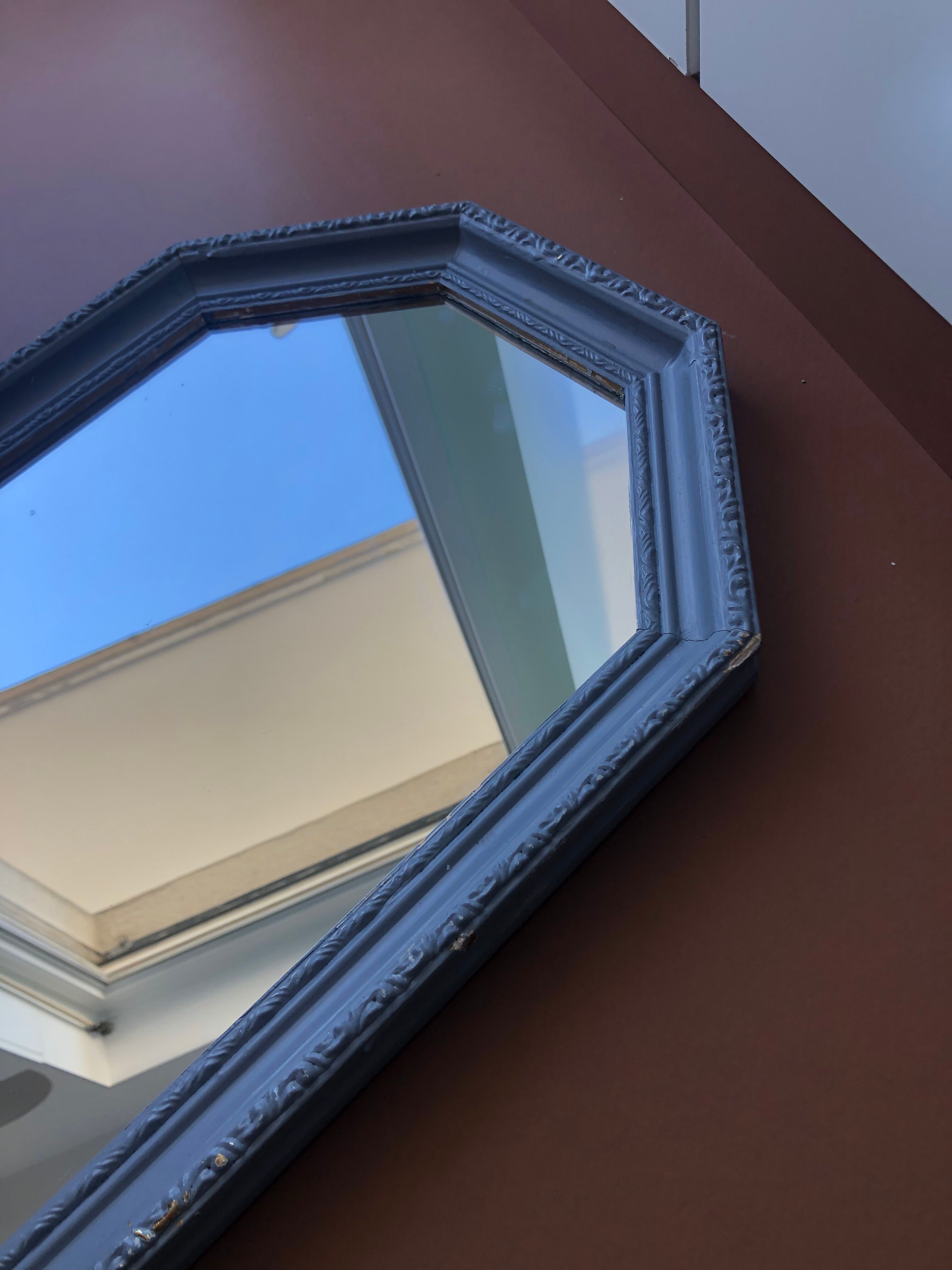 Old patinated mirror golden gray