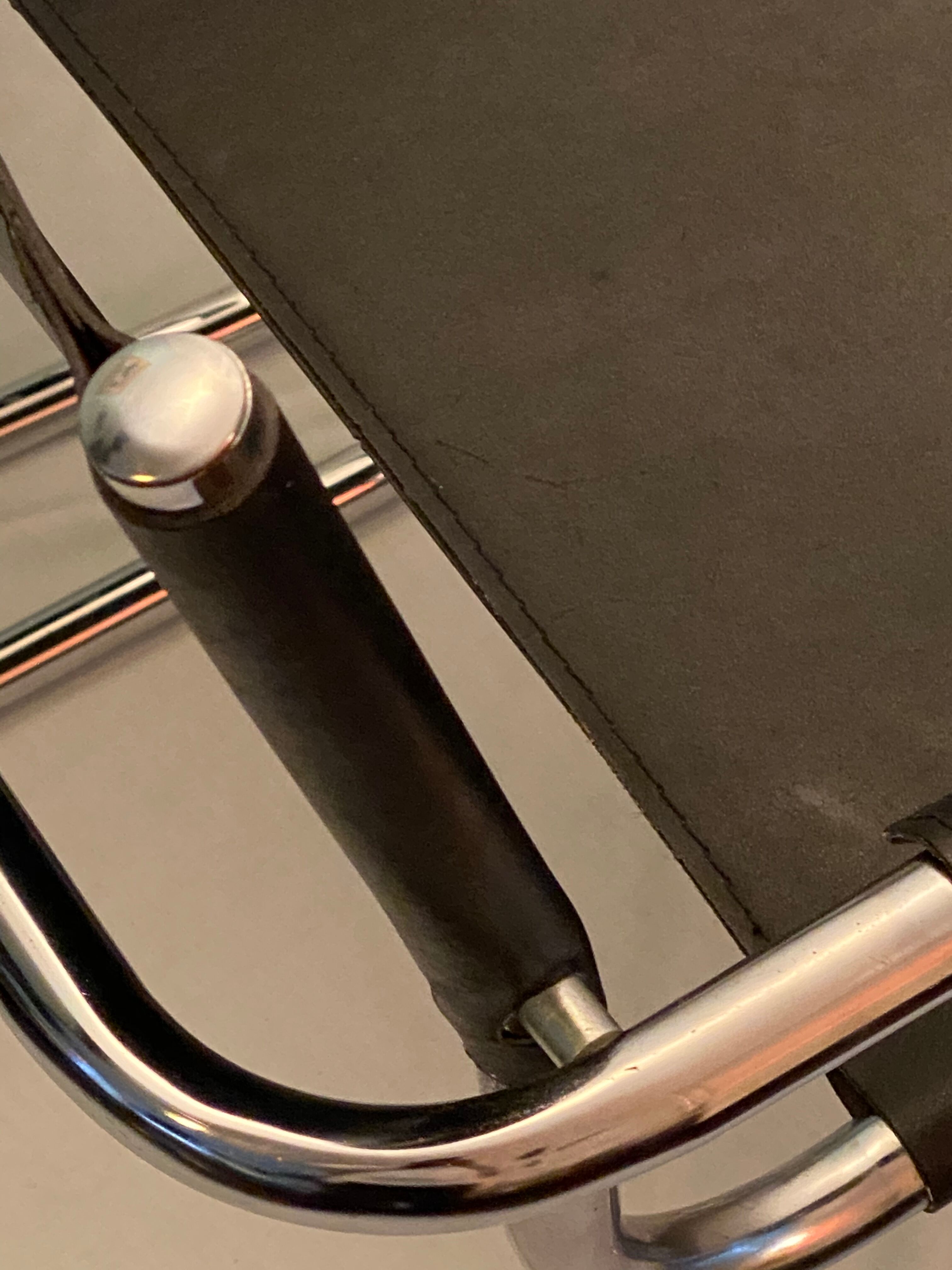 Pair of chrome and leather tube chairs