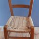 Wooden children's chair, rope seat, circa 1950