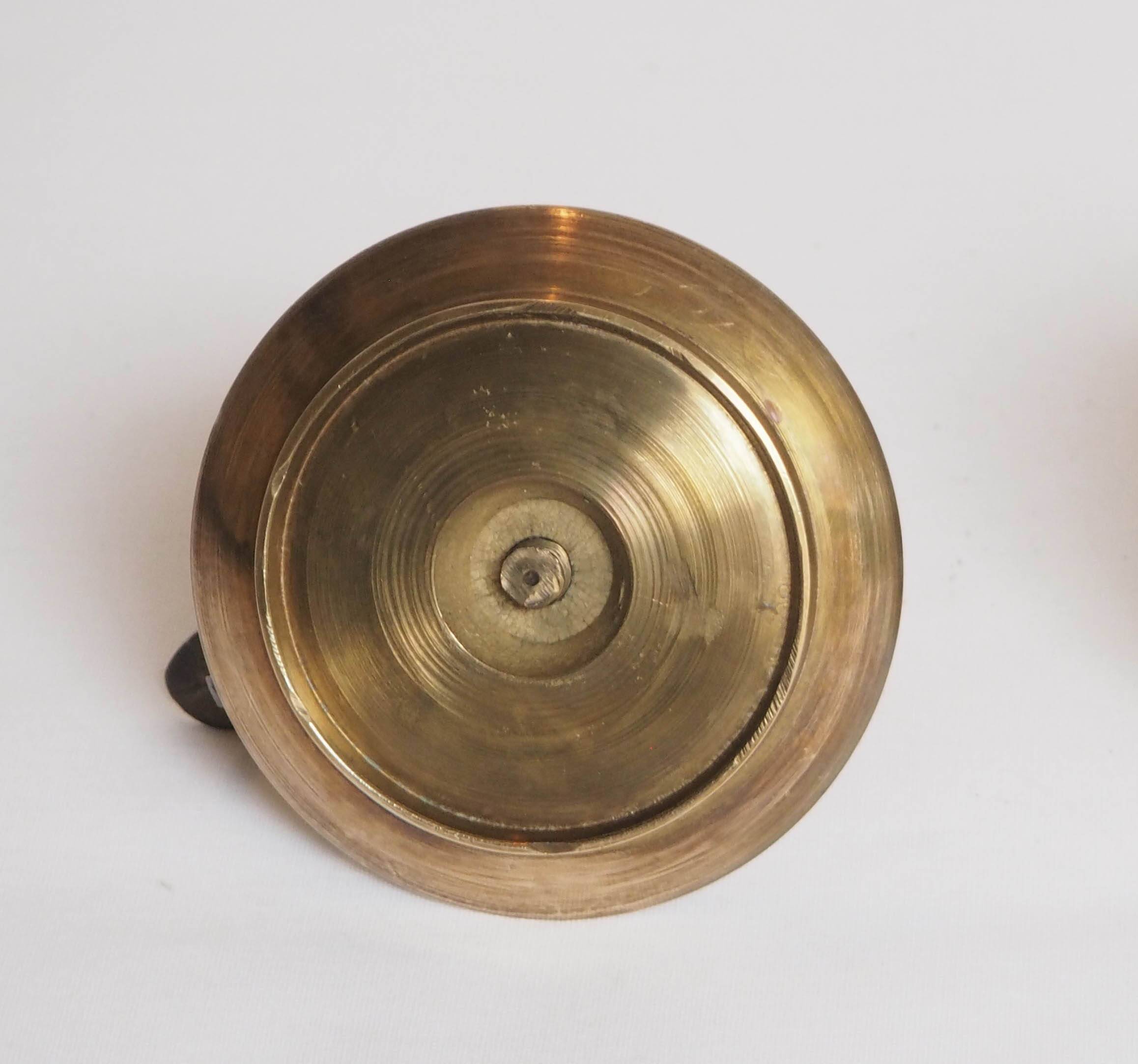 Brass candle holder with cup and handle