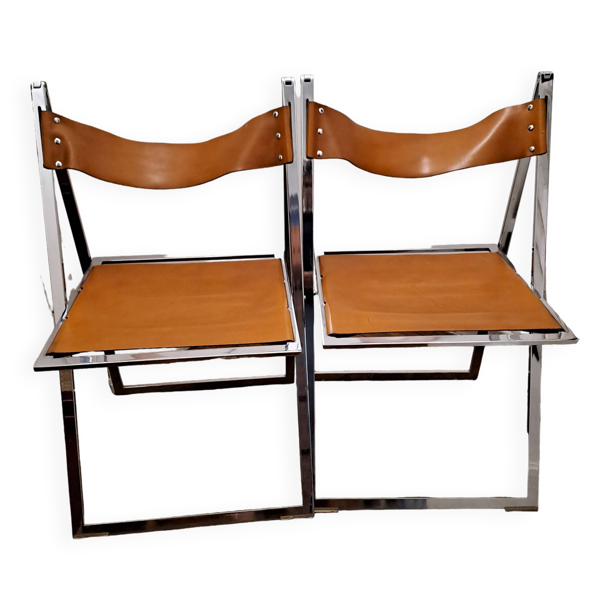 2 Chromed metal and leather folding chairs. 70s. Fontoni & Geraci