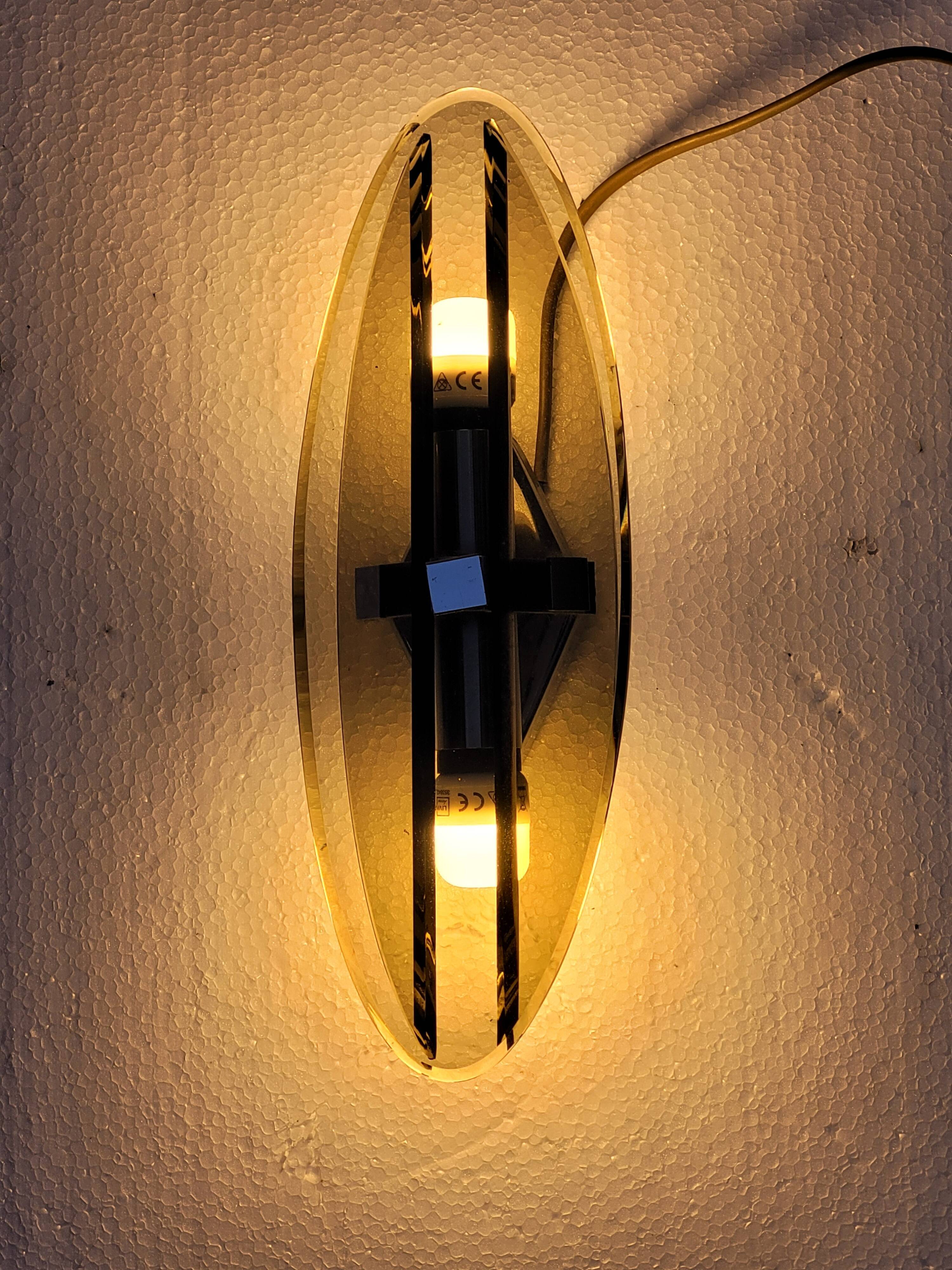 Pair of elliptical italian wall lamps in smoked glass and chrome veca