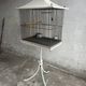 Vintage pagoda-style birdcage on a stand