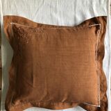 Old embroidered cushion tinted in speculoos
