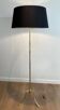 Brass floor lamp with a tripod base and claw feet from Maison Jansen.