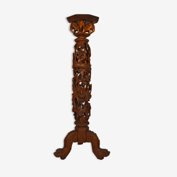 Indochinese high saddle in carved wood with mythological theme