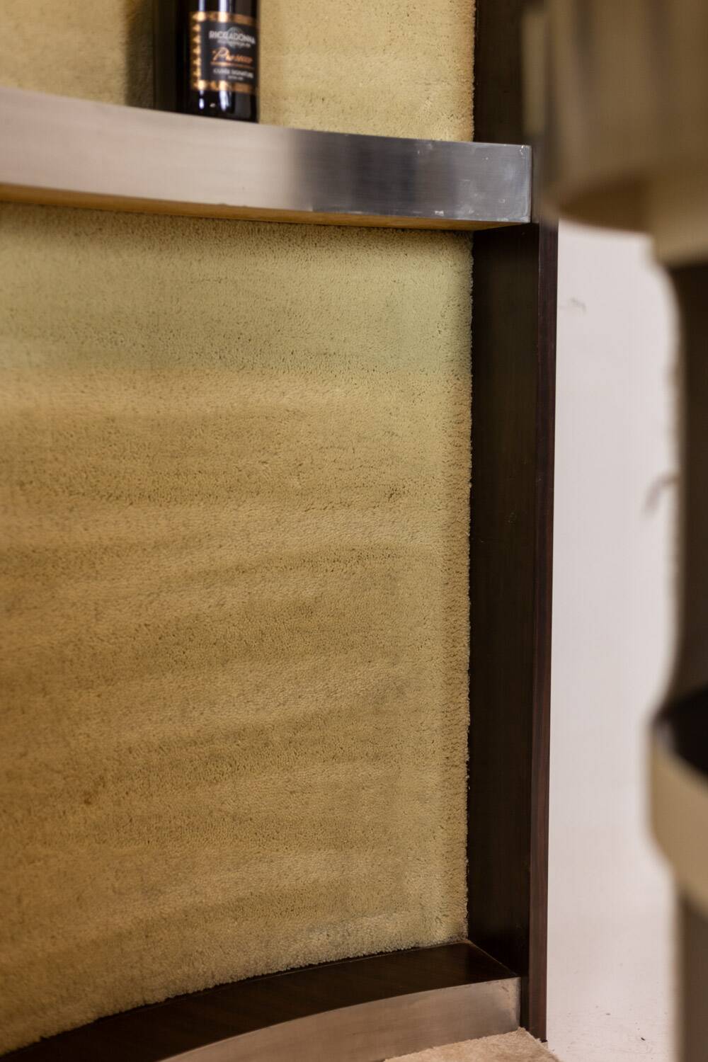 Circular bar in brushed metal, wood and carpet. 1970s.