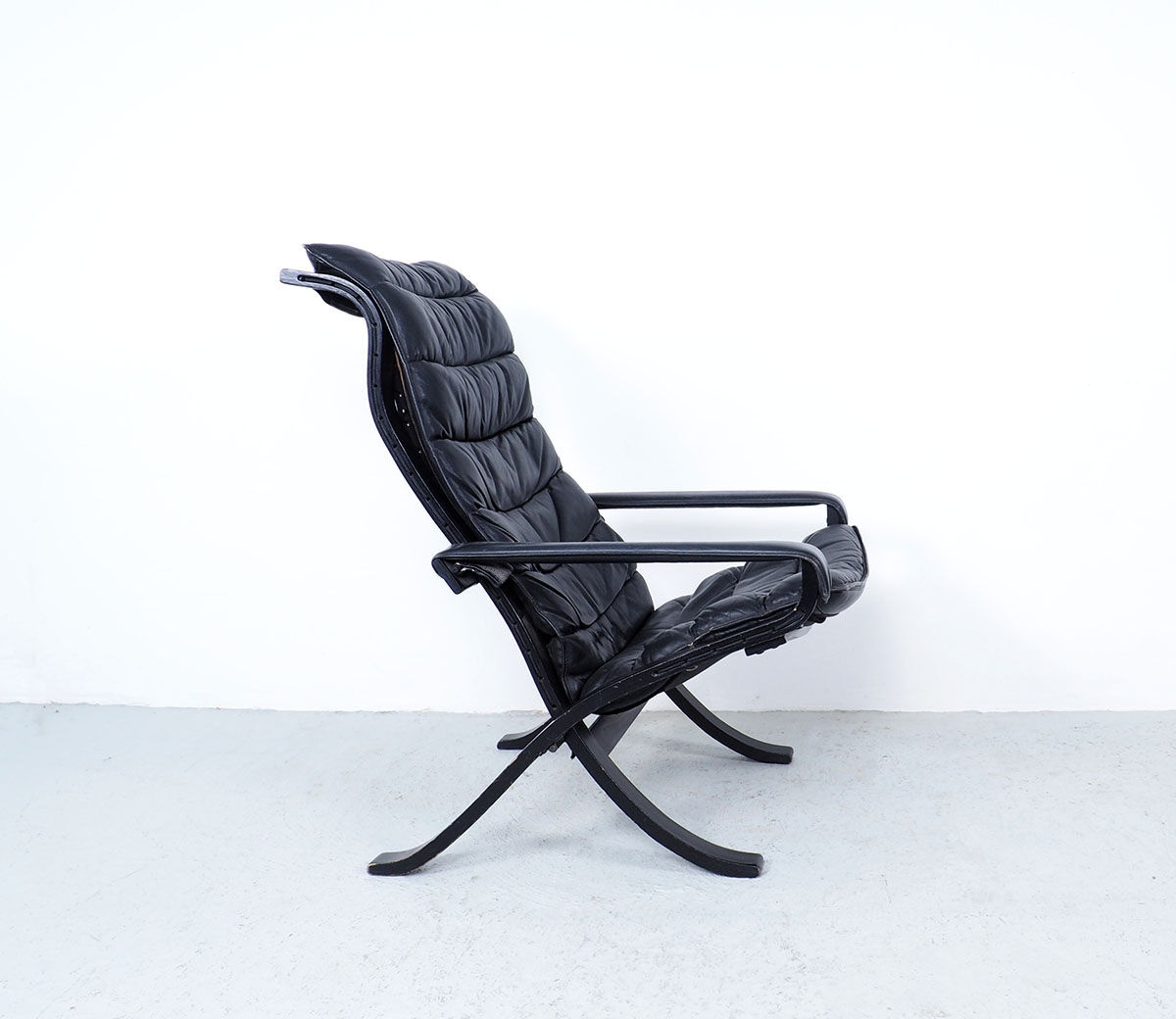 Westnofa black leather Flex armchair with ottoman