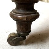 Round console table with folding shutters on copper wheels