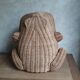 Frog in rattan magazine holder