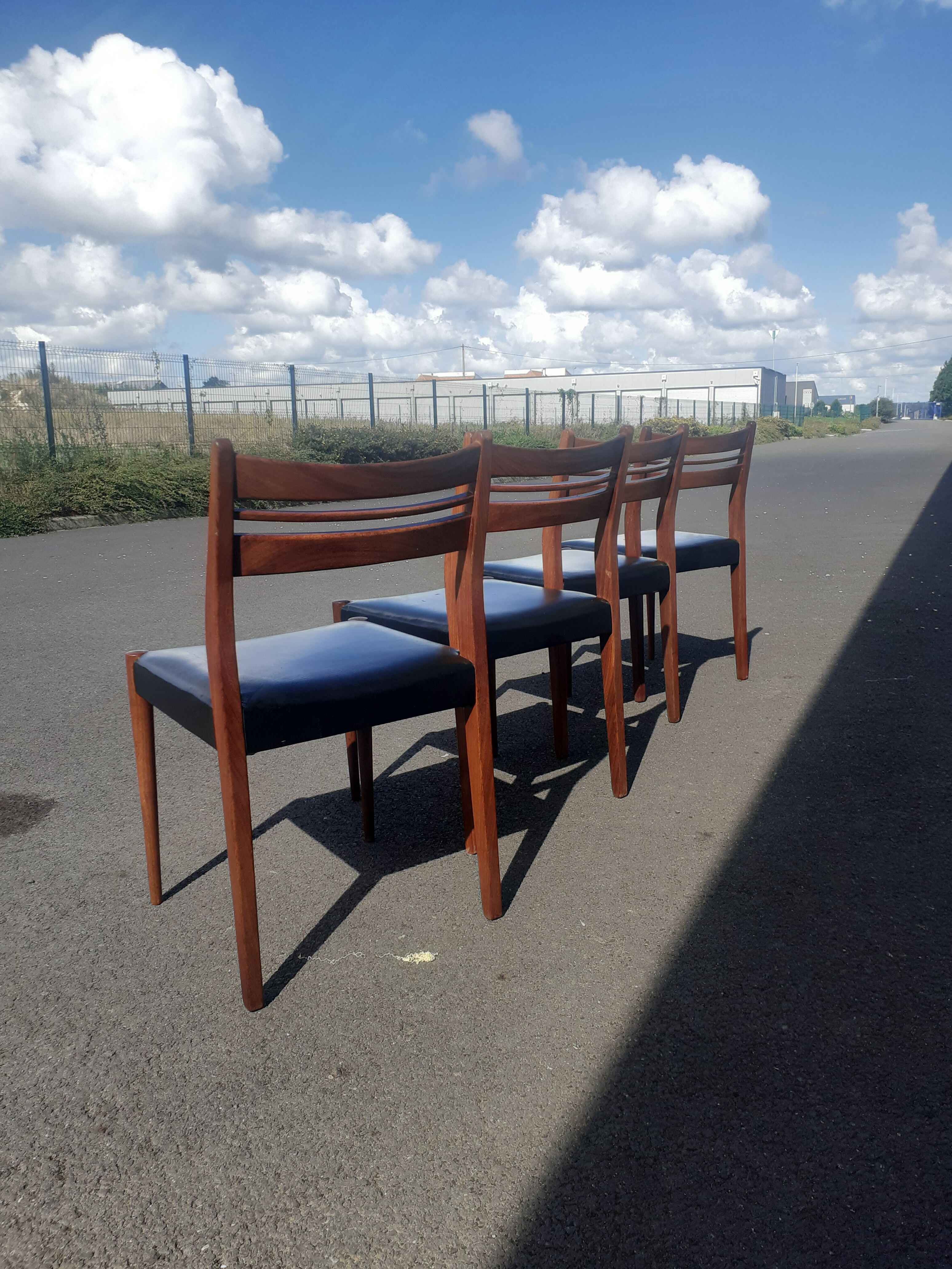Scandinavian chairs in teak and black skaï.