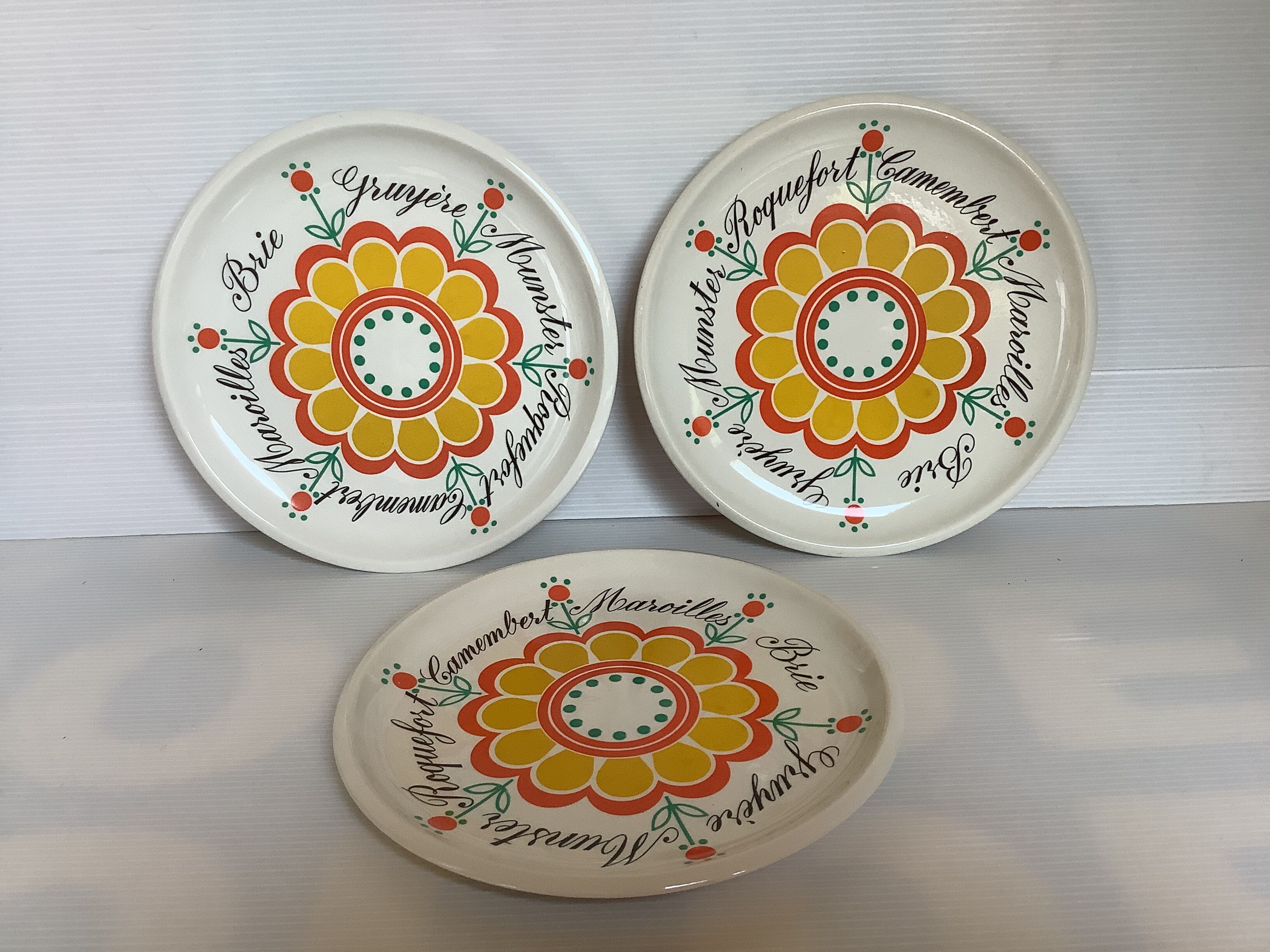 Six vintage floral cheese plates.