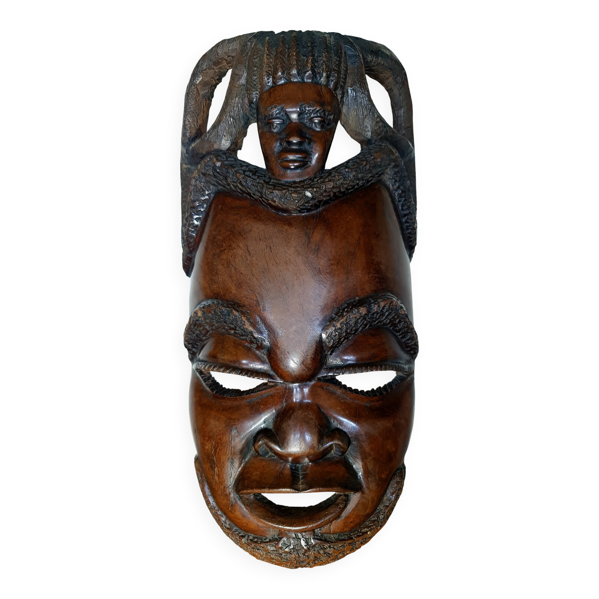 Enigmatic face of Africa carved in ebony wood