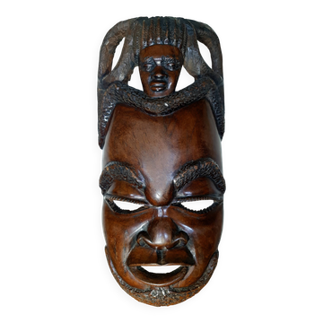 Enigmatic face of Africa carved in ebony wood