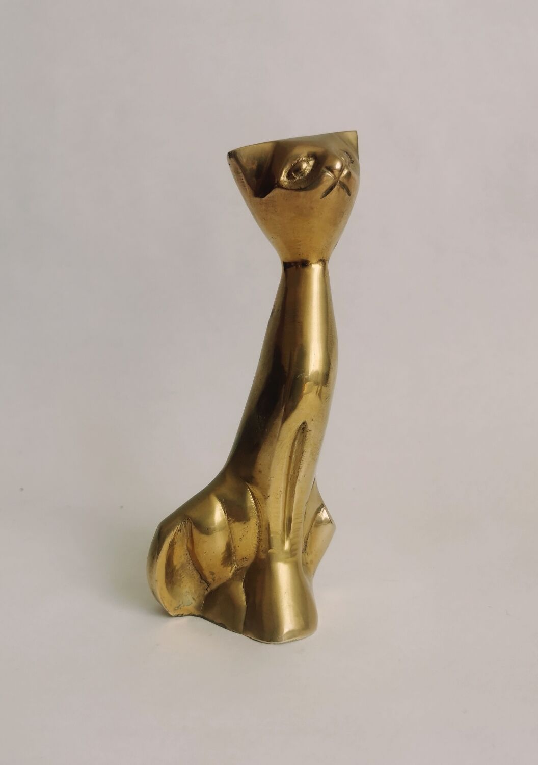 Trio of cats in gilded brass