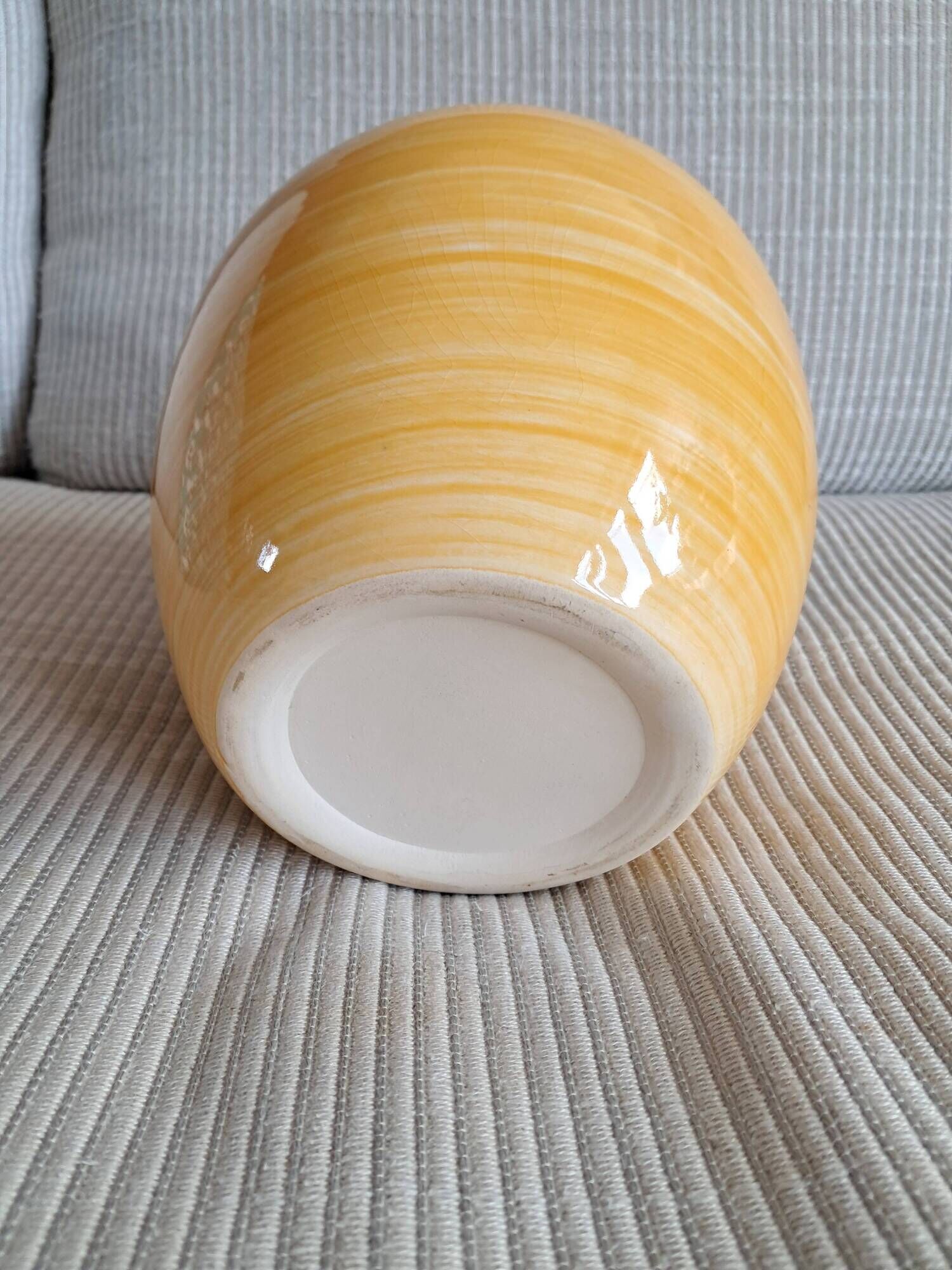 Vintage ceramic vase in a round shape.