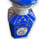 Perfume bottle in porcelain of old paris blue background