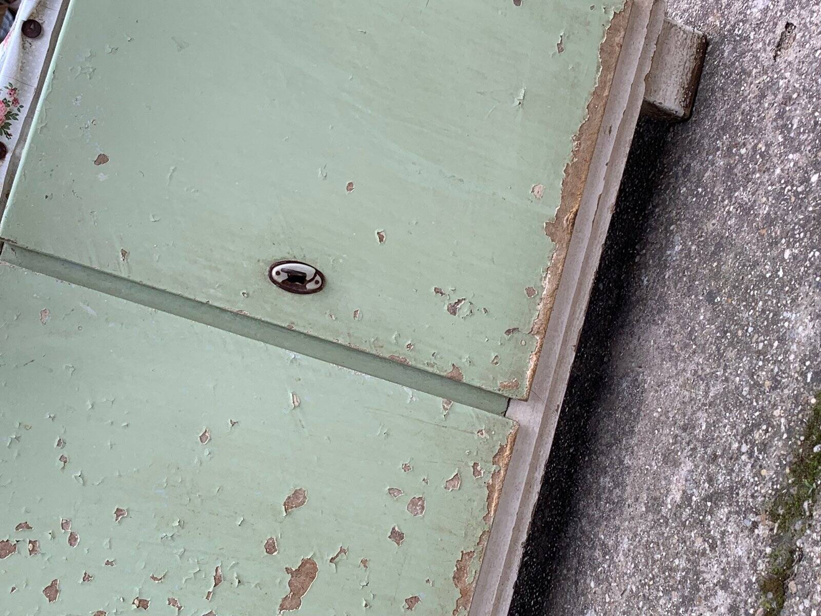 Vintage low wooden cabinet painted green and white with a floral fabric top (1950s)