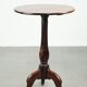 Round antique side/wine table from the late 18th century with a subtle foot