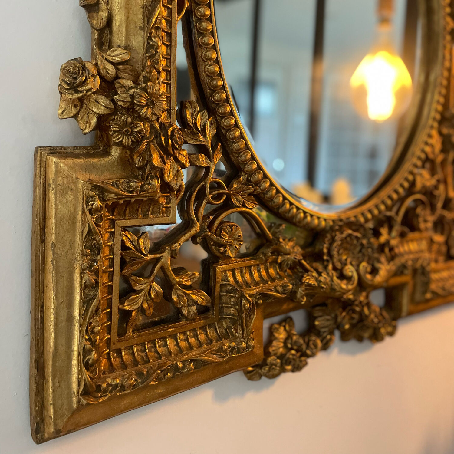 Antique mirror with gold leaf parecloses