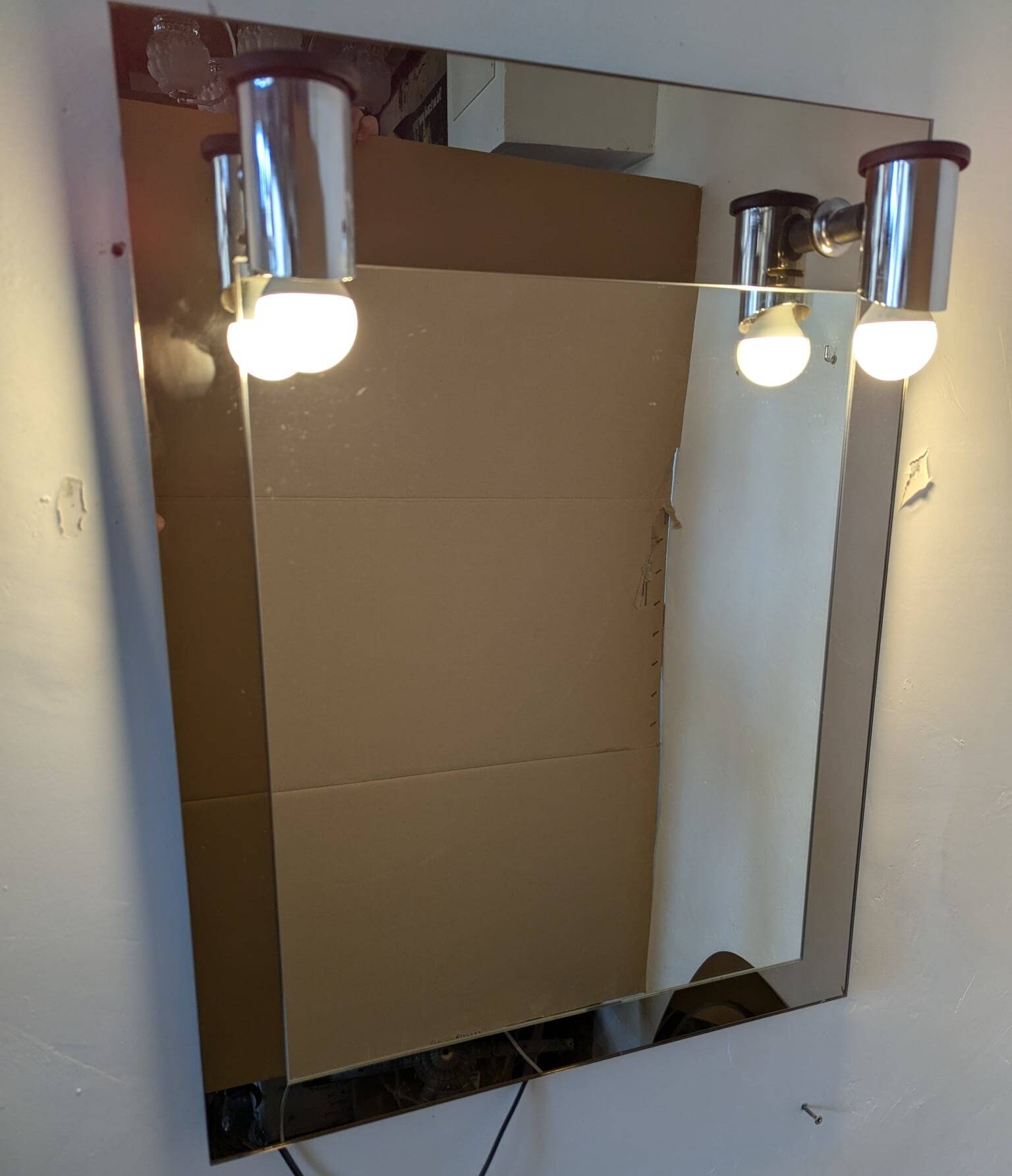 Vintage mirror with sconces.