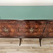Mid-century mahogany buffet with teal glass and compartments with a drawer.