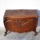 Old chest, carved wooden chest, curved chest on wheels, interior decoration