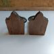 Medieval-style bookends, antique door handle.