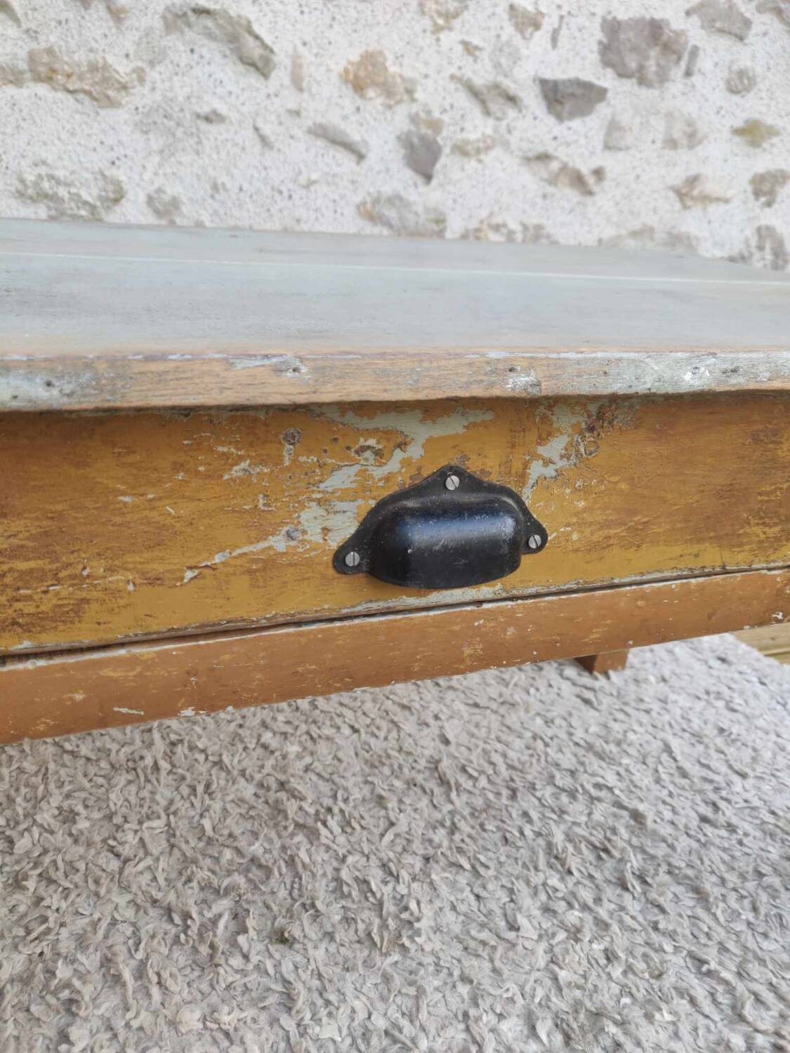 Patinated coffee table with a drawer