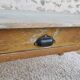Patinated coffee table with a drawer