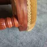 Upholstered stool on casters