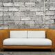 Canapé vintage en rotin design 1970 tissu bouclette écru