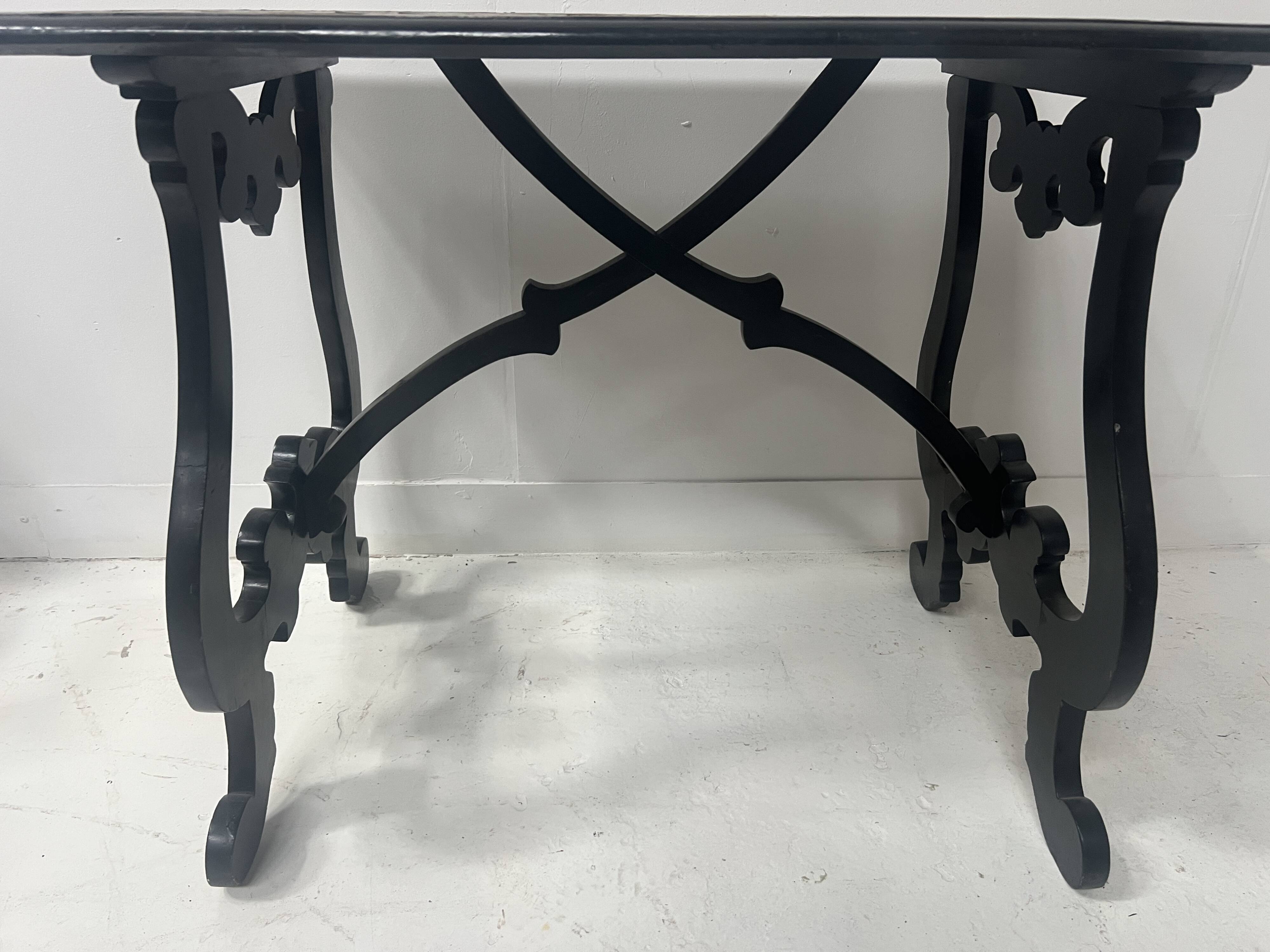 Blackened wood display table with marquetry top, Spain, 19th century.
