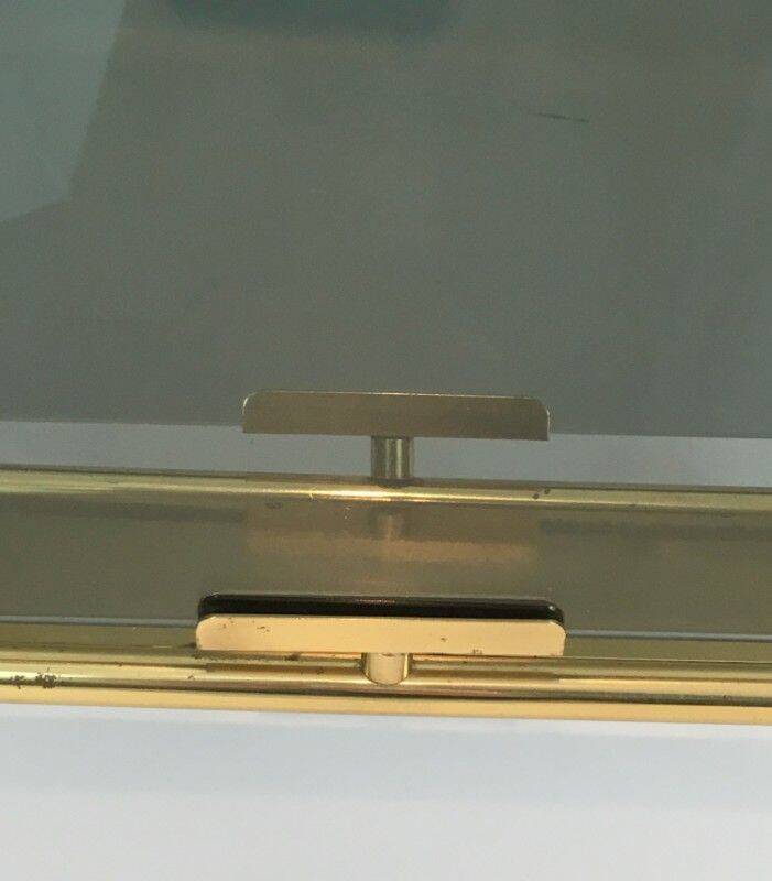 Neoclassical magazine rack in brass and blue glass